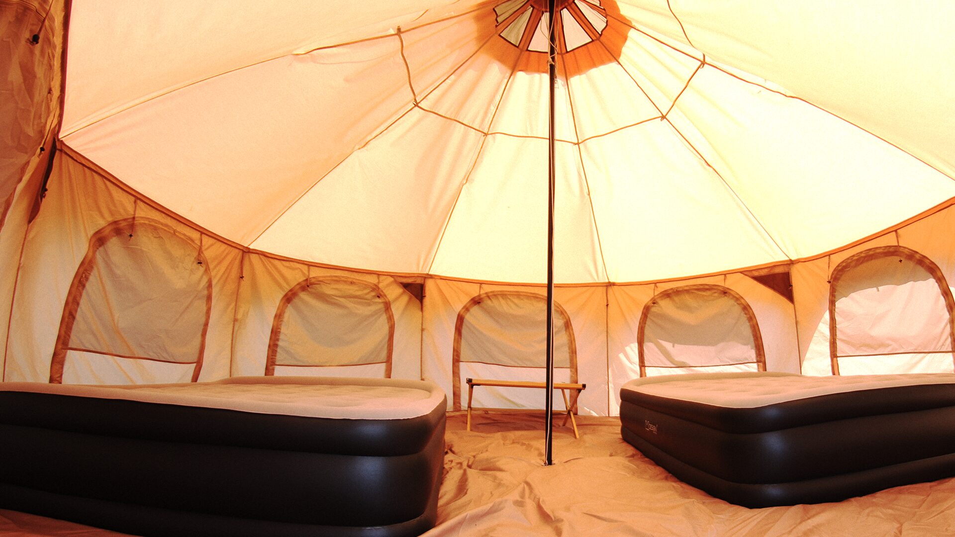 Inside the tent with two beds